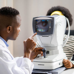 Doctor using eye examination technology on a patient