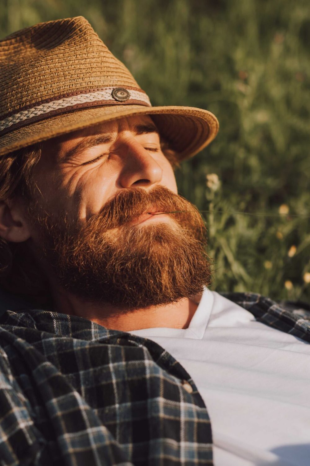 carefree-adult-man-lying-on-grassy-field-2022-11-12-03-06-25-utc